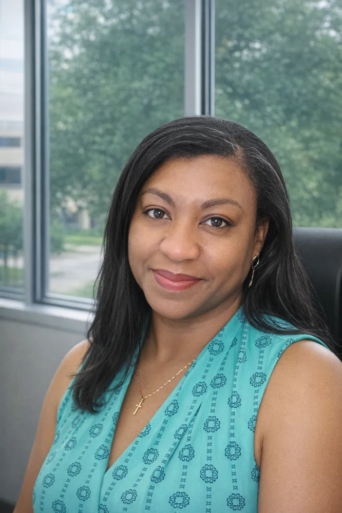 Corray Boughton, Executive Director of PACS Independent Living, smiling in a teal blouse
